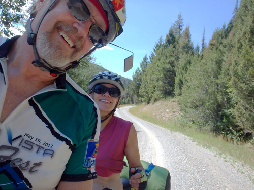 GDMBR: Dennis and Terry Struck, enjoying their Tandem Tour on the Great Divide Mountain Bike Route, near Reservoir Lake, Montana, on Helena's National Forest Road #4106.